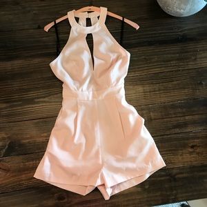 Blush pink Bebe Romper.  Size 0.  NWT